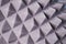 The pattern of the soundproof panel of polyurethane foam. black geometric background