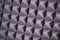 The pattern of the soundproof panel of polyurethane foam. black geometric background