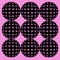 Pattern of spheres created af black polka dots with shadows on pink background.
