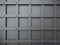 Pattern of squares grid on a gray iron door