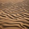 A pattern of tire tracks in the sand of a vast desert dunescape2