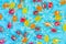 Pattern of a variety of multi-colored candy on a blue background