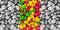 Pattern vertical toned with bright panels of candies yellow red pink green contrast background