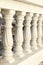 Pattern of white balusters. Architectural elements of stairs and railings. Beautiful repeating pattern.