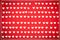 pattern of white hearts on a red background with a border of small hearts