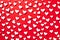 pattern of white hearts on a red background with a border of small hearts