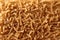 Pattern of wholegrain spelt fusilli. Abstract background