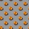 Pattern of yellow Christmas balls on a gray background. Color of the year 2021 ultimate gray. Trending color. Holiday concept