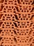 patterned abstract background, made of piles of stone building materials made of red clay