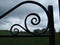 Patterned iron gate leading to field