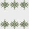 Patterns of spruce branches in the form of snowflakes on a white background.