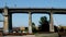 Pattullo Bridge over Fraser River train passing under bridge. close-up shot from technological site scattered iron beams