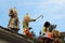 Paucartambo Peru during the procession of the Saqras mischievous devils surround it from the roofs and balconies