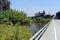 Paved bridge road winding through a flowing stream of water