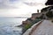 Paved coastal walkway on a summer evening