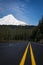Paved highway beneath snowy Mount Hood, Oregon