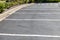 Paved and lined parking lot, asphalt with formed concrete curb