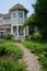 Paved path leading to farmhouse in European-style