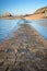 Paved path to Grand Be and Petit Be islands at low tide in Saint Malo, Brittany France