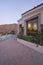 Paved Poolside Area And Window Exteriors Of House