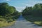 Paved road in the countryside next to forest