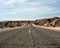 Paved road through desert