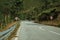 Paved road passing through hilly landscape