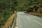 Paved road passing through hilly landscape