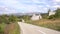 Paved road past triangular houses in Durmitor National Park