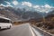 Paved road with a view of snow capped mountain range, Karakoram highway. Pakistan