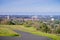 Paved running trail on the Standford dish surrounding hills; Stanford campus, Palo Alto and Silicon Valley skyline in the