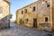 Paved street, old buildings and in the background the field Medinaceli City. Soria Castile and LeÃ³n Spain