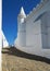 The paved street and the wall of Main church Igreja matriz in