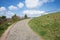 Paved walkway up the hill, with curve