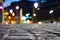 Pavement and blurred city light during night time