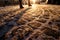 Pavement with cobblestones in winter and female legs