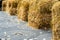 The pavement covered cubes of dry hay.