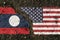 On the pavement, images of the flags of Laos and the United States, as a symbol of confrontation.