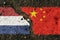 On the pavement, the images of the flags of the Netherlands and China, as a symbol of confrontation.