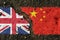 On the pavement, the images of the flags of the UK and China, as a symbol of confrontation.