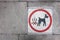 Pavement sign warning pet owners to clean up after dog poo