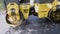 Paver, paving machine. Yellow old asphalt paving machine rolls asphalt on street