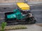 Paver at the time of repairing roads, laying new roads, steamroller heavy machine, modern technology of asphalt roads