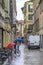 PAVIA, ITALY - MAY 14, 2018: This is one of the streets of the old city under the warm spring rain