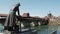 Pavia skyline with cathedral, laundress statue, old covered bridge and river Ticino, Italy