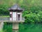 A pavilion at the lake with mountains background