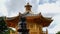 A pavilion and a lion statue at nan lian gardens in hong kong