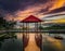 Pavilion on the pond at sunset