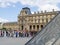 Pavilion Richelieu, with people around glass pyramid of Louvre Paris