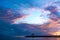 Pavilion and Sailing Boat in Ocean During Sunset